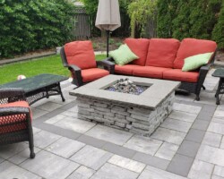 Stone fireplace on patio with seating