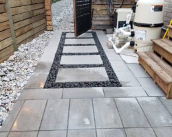 Stone Walkway_black river rock border