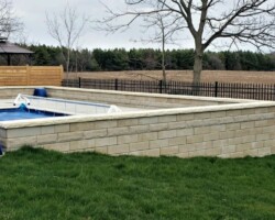 Retaining round around raised inground pool